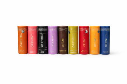 Row of colourful Orientica bottles on a white background